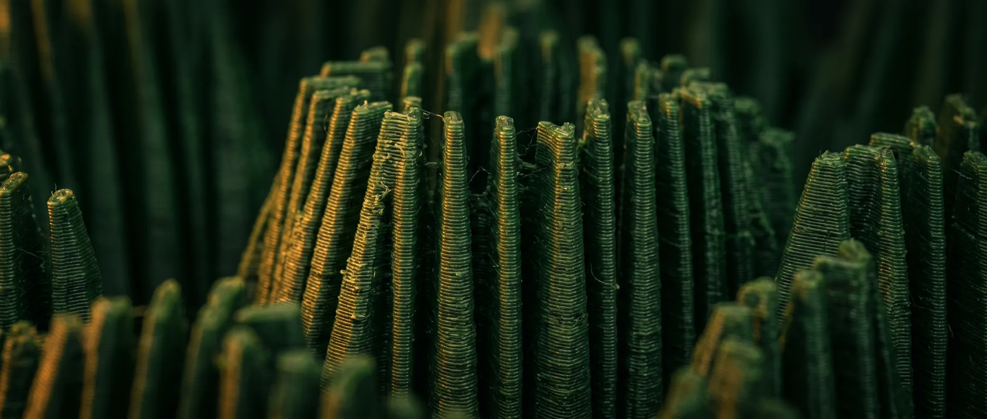 Macro view of 3D-printed ribbed flutes in forest green
